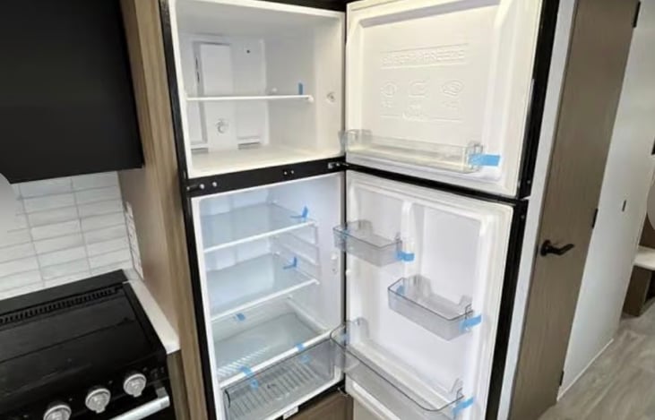Fridge and full kitchen