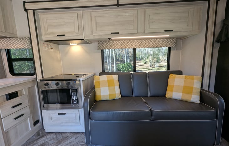 Spacious, bright & modern interior. Well-stocked kitchen with stove-top and convection microwave. Comfy couch and dinette both convert to beds. Large overhead bunk with swing-out TV for entertainment.