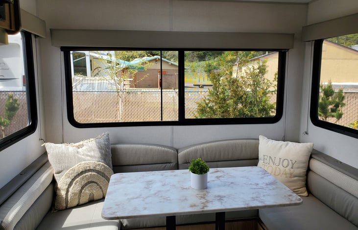 Large dinette with windows on each side