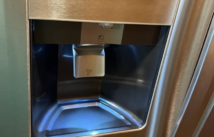 Ice and water dispenser on fridge