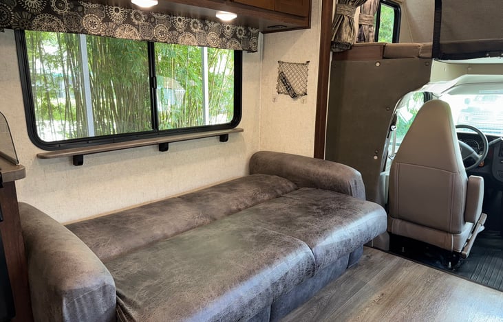 Jackknife sofa converts into a bed approximately 58" long by 40" wide