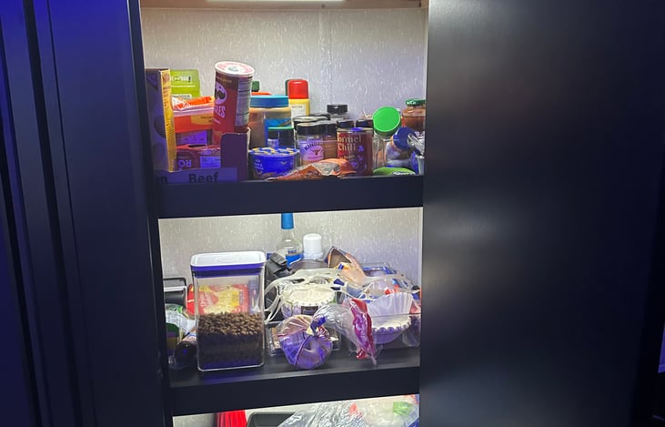 Pantry area with under shelf lighting. Plenty of Spices, and Supplies!