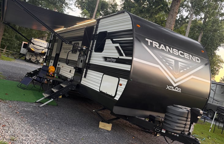 Camper contains 2 doors for entry. The front door enters into the living/kitchen area. The back door enters the bathroom directly.