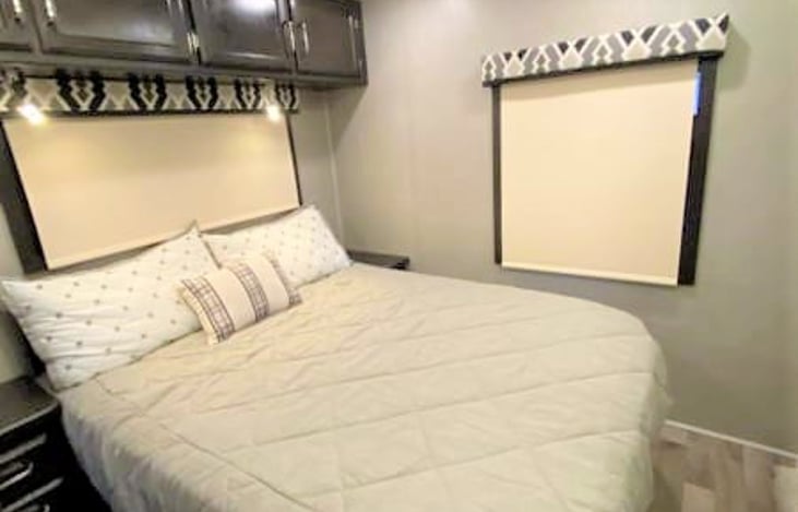 So Cozy! Wake refreshed in this Queen size master bed!