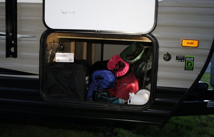 We include camping chairs, smore sticks, a large outdoor rug, garbage can, small table and more!