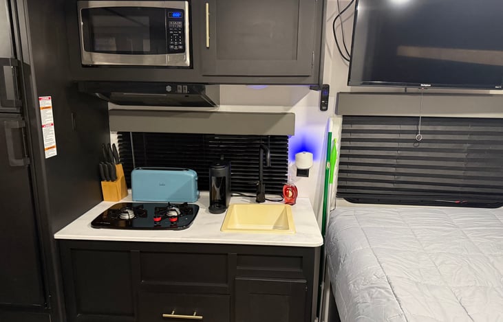 Kitchen with Microwave, toaster oven, toaster, and Keurig coffee maker