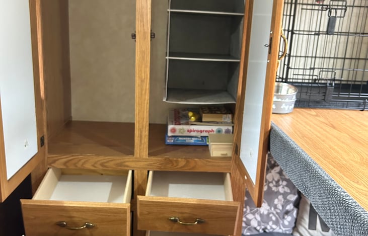 Bunkhouse storage and dog pen with dog dishes