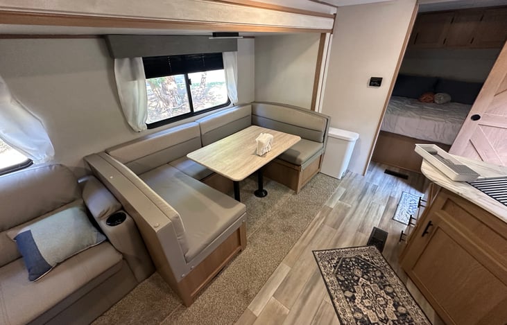 U Shaped dinette breaks down into a bed.