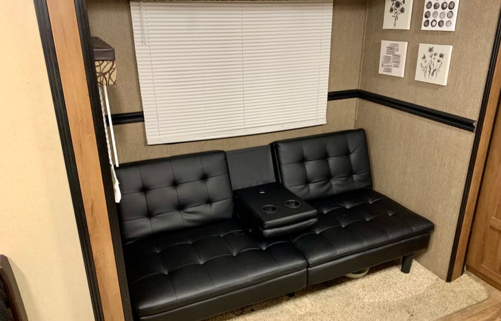 Adjustable memory foam futon with a center cupholder/USB outlets