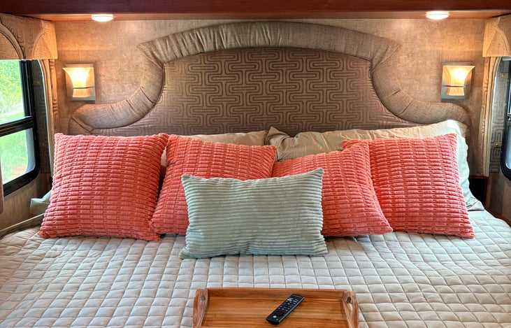 King size bed with comfy bedding and new mattress with reading lights.