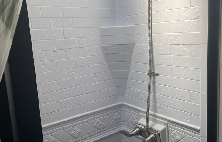 Full size indoor shower that can use either city water connection, or water from the clean tank and water pump onboard. The bathroom door closes to allow for privacy in the back portion of the RV.