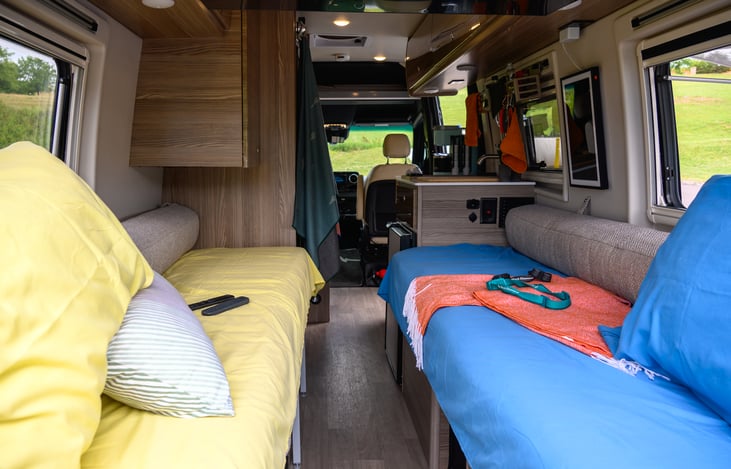 Two singles/couches that move together to form nearly a king-sized bed.