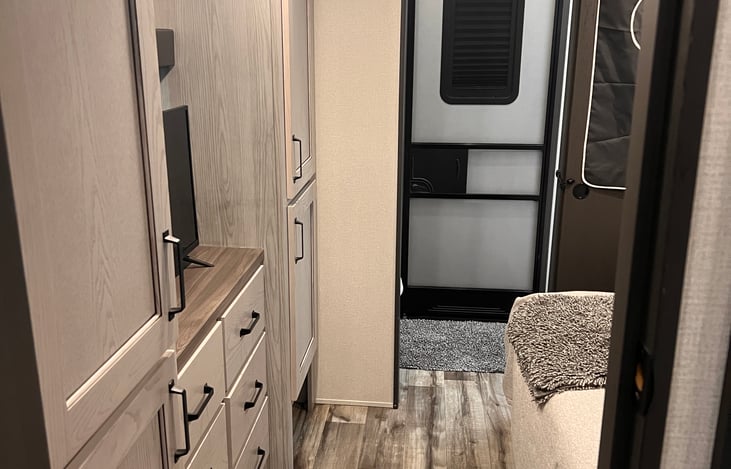 Guest bedroom into guest bathroom and rear entry door.