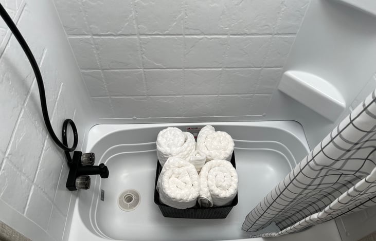 Fresh shower towels, rags and soap dispenser ready to go!