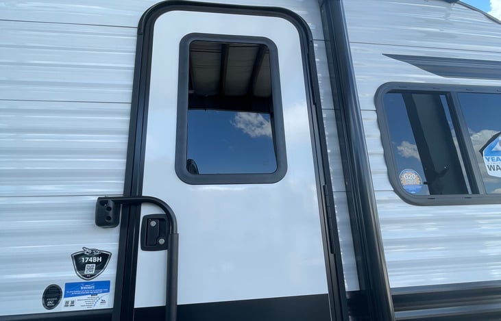 Entry door handle in lock and door safety travel position .