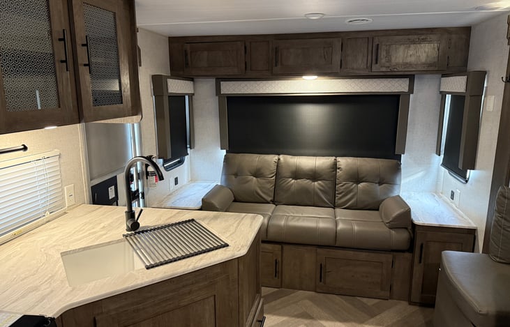 The rear jackknife sofa is lots of storage above and below. Folds down into sleep spot. Prefect for littles or "compact" adults. However if you are over 5'6" you might find it a bit snug.