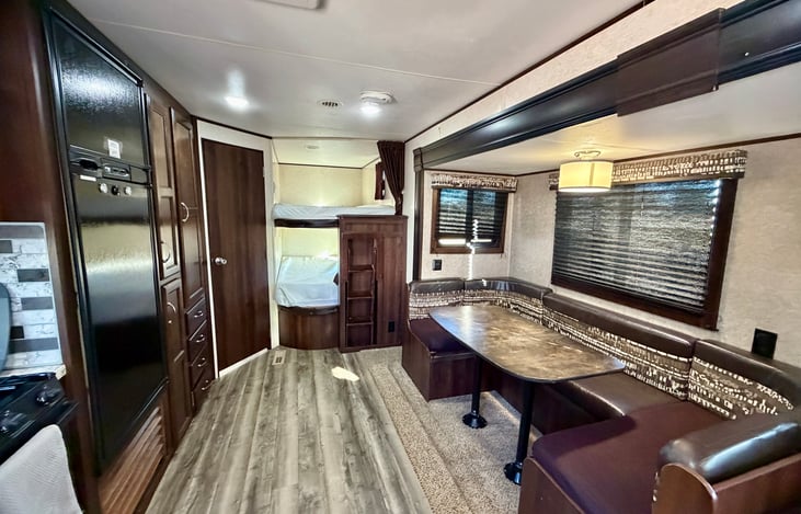 Dining area, table converts to twin bed.