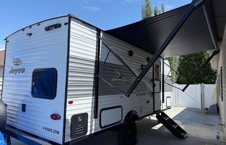 camper entrance with awning extended (should always put awning away with severe winds or storms)
