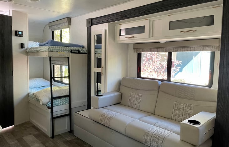 Boys love their bunk beds with privacy light, USB ports, own window, and own lil cubby.  Also, you see the sofa will convert into bed.