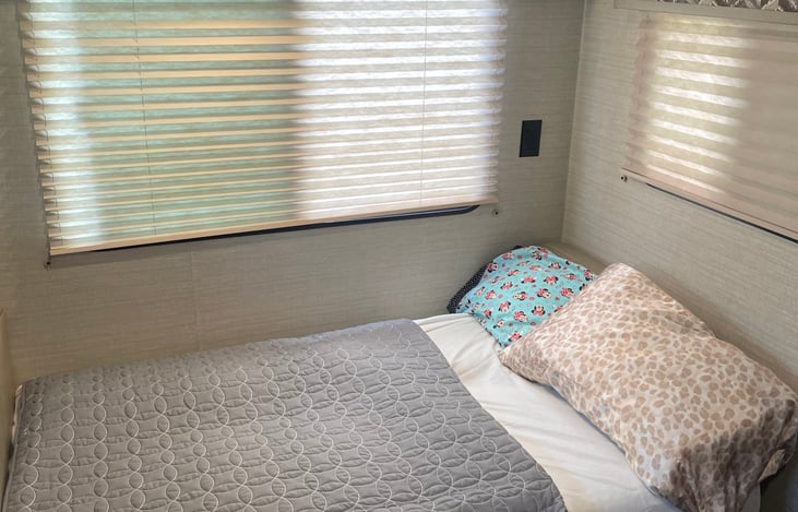 Sofa converted into bed.