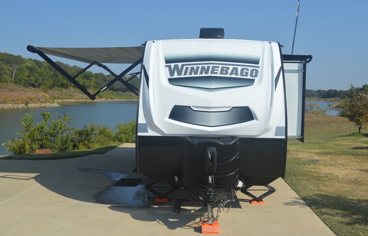 Front of trailer with awning extended and slide out.