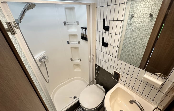 Full bathroom in the rear of the unit. Small but mighty!