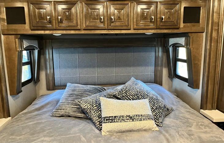 Master king-size bed which folds away as a slide for traveling