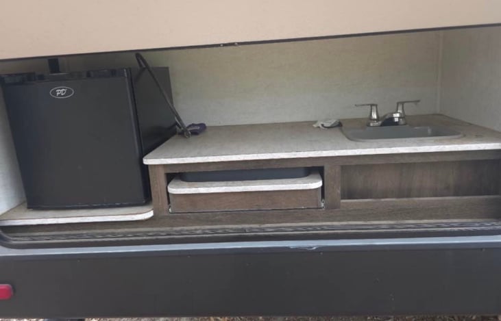 Outdoor mini kitchen and grill.