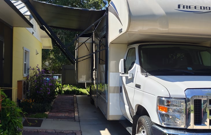 The right slide extended out with the awning extended.