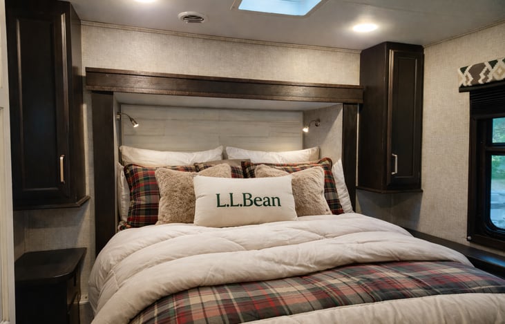 The master bedroom slide-out provides a good-sized, north-south-facing room with 2 windows, TV, and a skylight with fan.