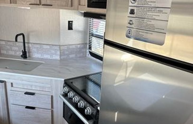 Here is another glance at the kitchen are. full of space once the slide out is fully extended. And a really big size fridge coming in at 10.7 Cu Ft!.