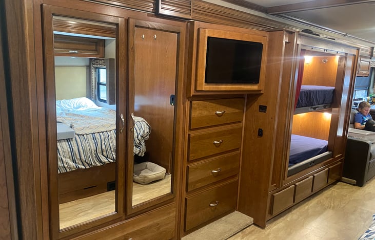 Master Bedroom Closet area. Sliding door closes between bunkbed and master bedroom TV.