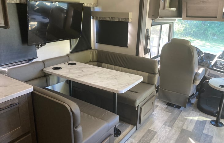 Living room table with TV - the table lays down to a double bed