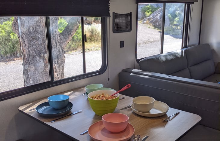 Dinner is served! Table and couch fold down into full beds.