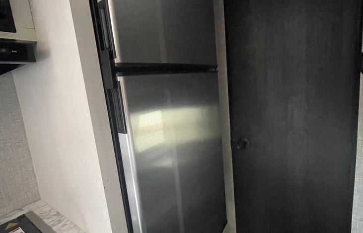 Stainless steel 6 cubic feet stainless steel refrigerator with safety lock handles.