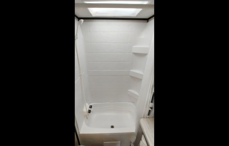 Bath: Shower/tub combination with hot/cold water, skylight and shelving. Detachable shower head for easy rinse off.