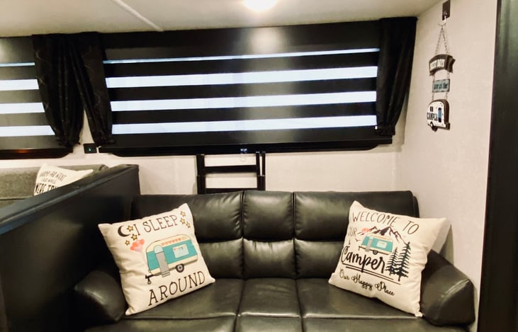 A comfy leather couch that converts into a bed for sleeping or just plain TV viewing!