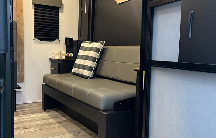 Sofa and Murphy Queen Bed stored away