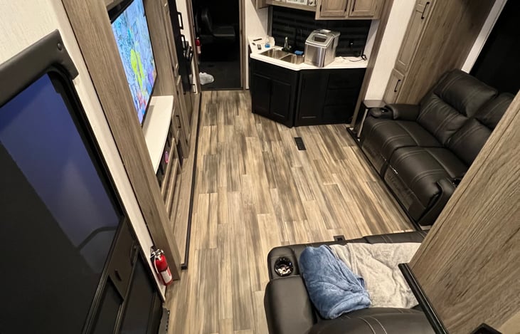 Loft above kitchen sink with 2 twin beds.