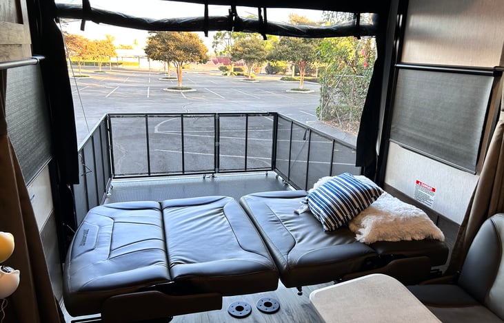 Couches laid flat to create a cozy bottom bunk bed at night. Bedding not included for sofa beds.