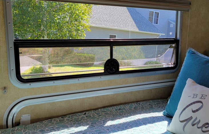 Large crank out window in bedroom for cross ventilation.