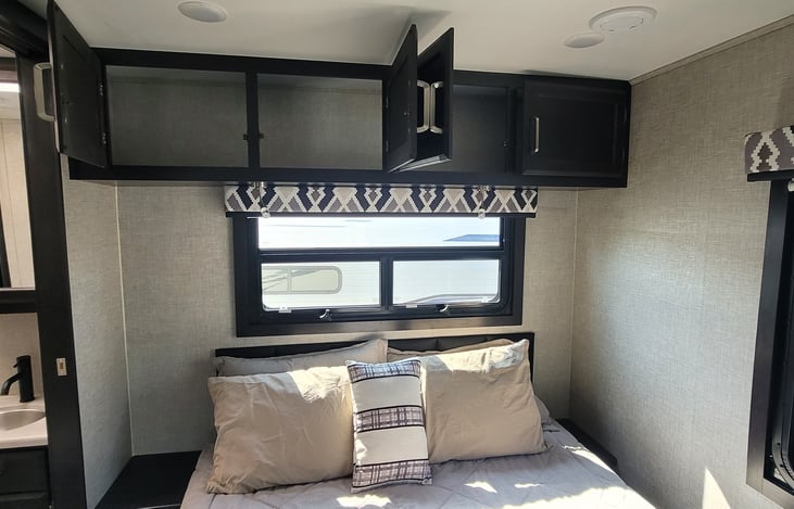 Above the bed cabinets