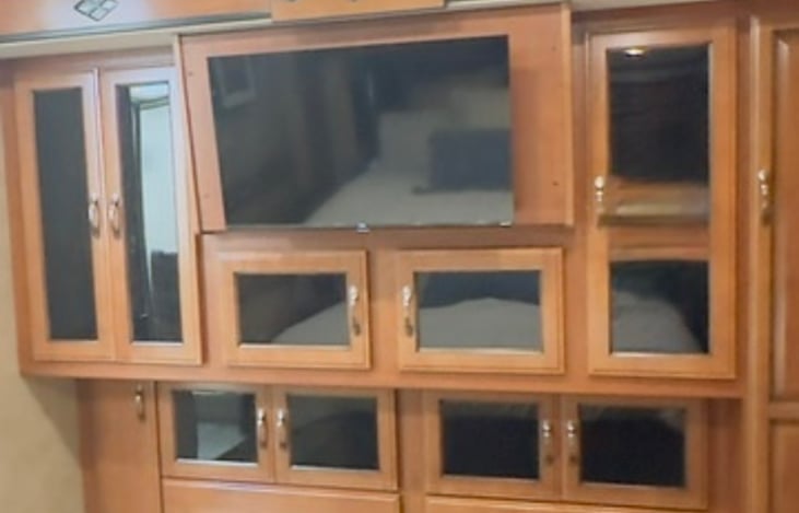 The wardrobe located across from the bed has a TV equipped with a Firestick for streaming. A large empty separated closet is provided for wardrobe, shoes and accessories and utility closet.