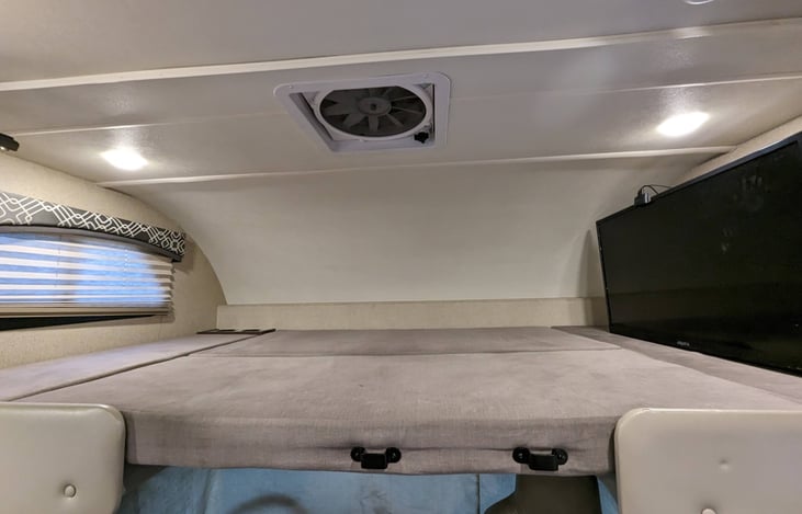 flat screen tv swivels out for viewing from kitchen and dinette