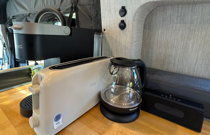 Start your day on the road with homey comforts—brew coffee with the Keurig, boil water, toast breakfast, and stream tunes on the Bluetooth speaker. Everything you need for a cozy adventure.