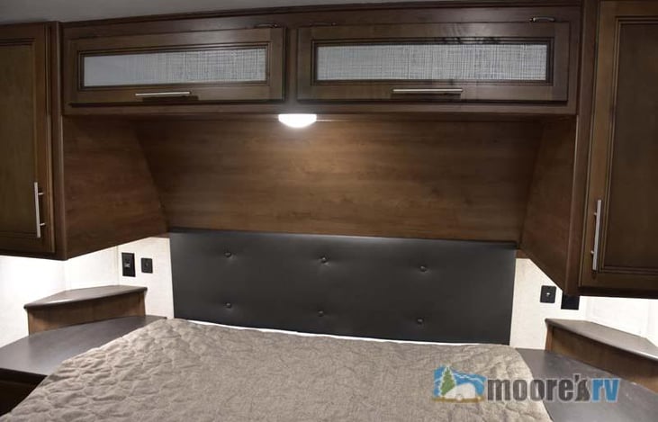 Queen size bed with plenty of storage in the slide out to the left of the bed.