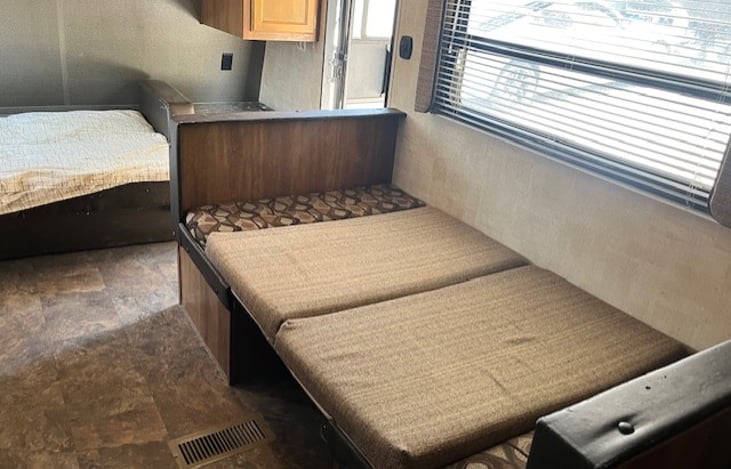 Dinette table converts to bed.