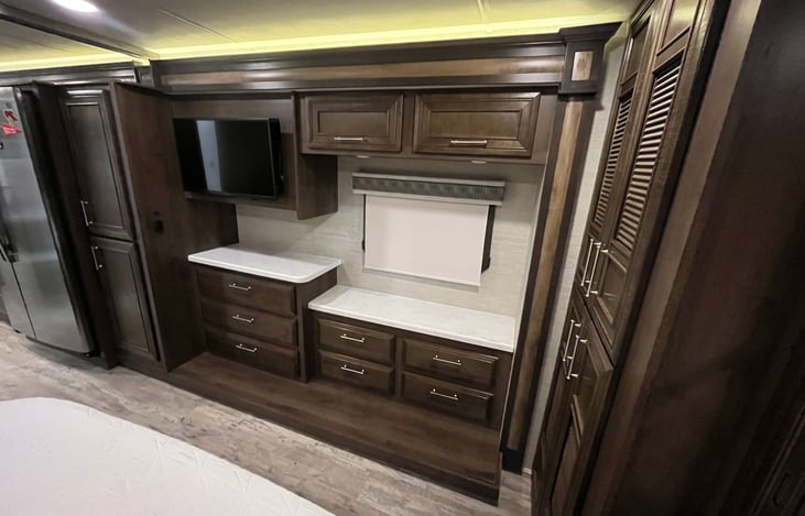 Bedroom dressers with TV.