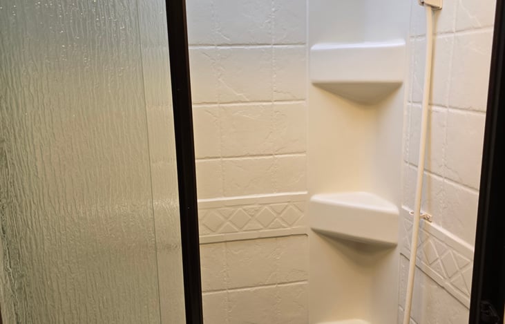 Shower has a small tube base