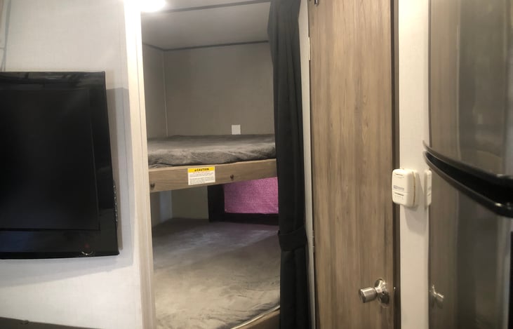 Double size bunk beds with curtains for privacy